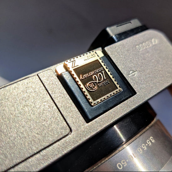 100th anniversary nikon hot shoe cover front view