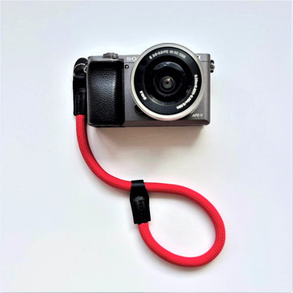 Sony camera with a red rope wrist strap