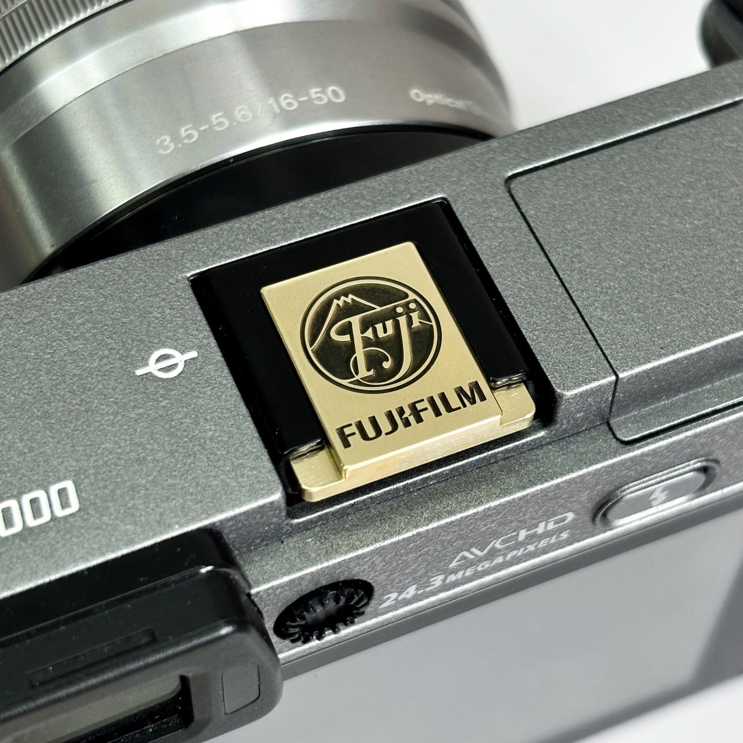 fujifilm logo hot shoe cover gold brass design