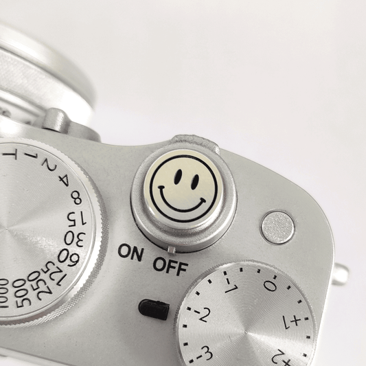 Silver smile shutter button mounted on Fuji X100V