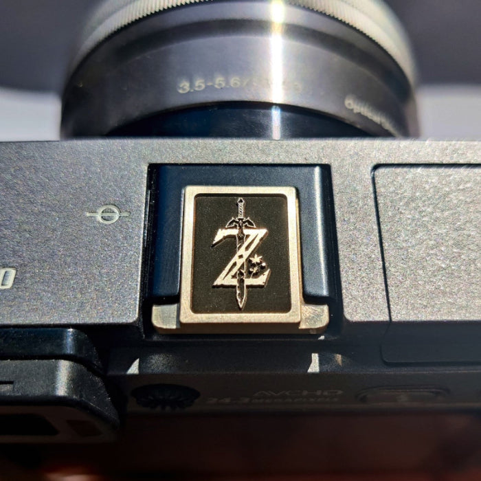 arcane crest engraved gold hot shoe cover for camera