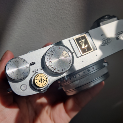 symbolic gold metal hot shoe accessory