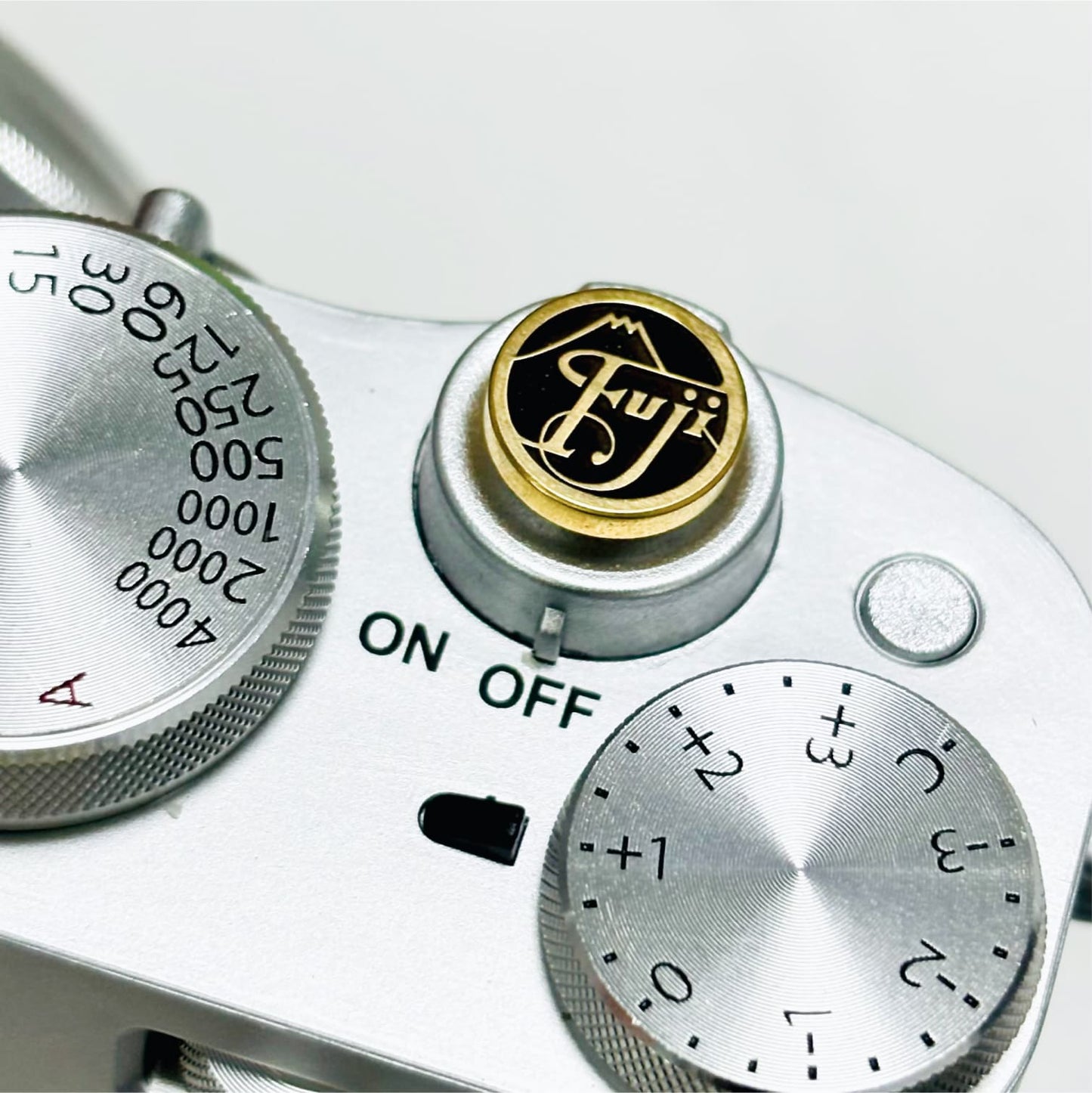 Fujifilm X-series gold soft release button