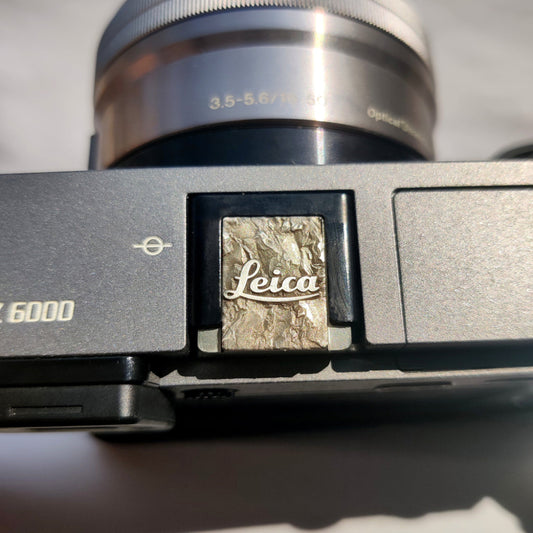 silver Leica M hot shoe cover with engraved mountain design