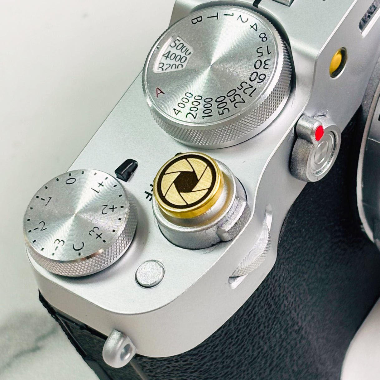 Gold Lens Master button engraved with vintage shutter design
