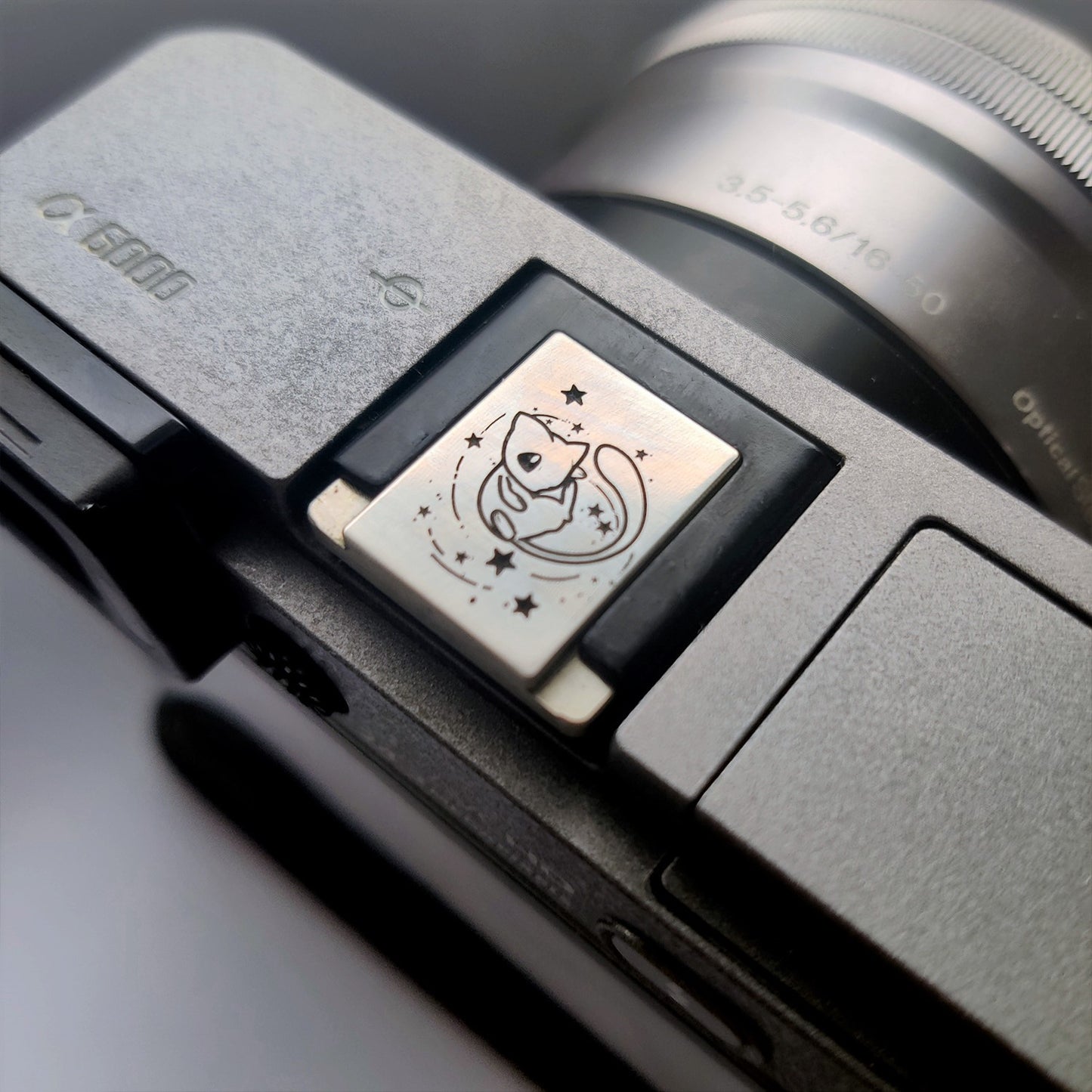 engraved pokemon-style hot shoe accessory