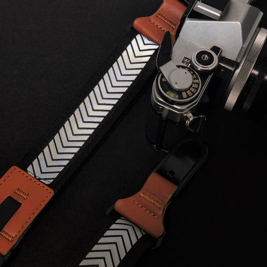 Night photography camera strap with reflective strip