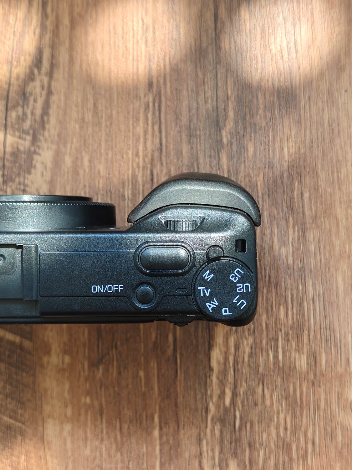 Ricoh GR III with wooden grip - top view showing ergonomic design