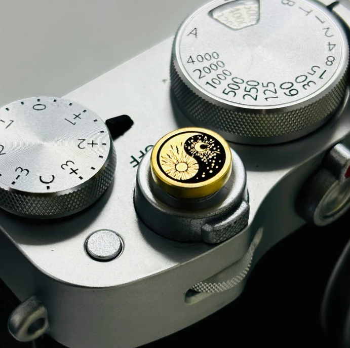 soluna camera shutter button with sun and moon engraving