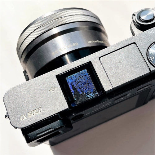 starry night design hot shoe cover on sony camera