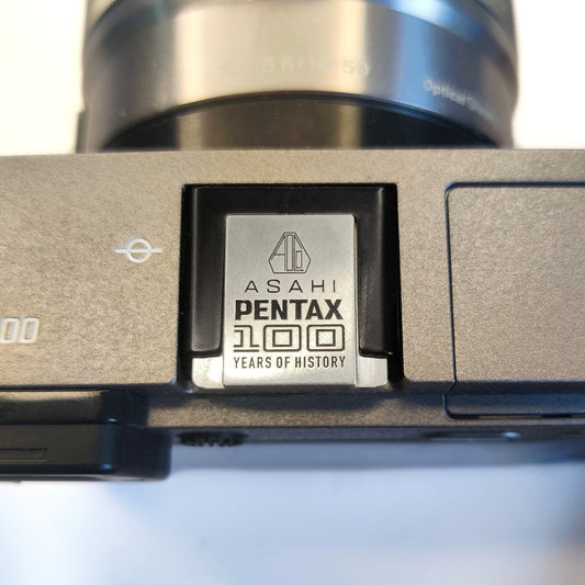 Pentax 100 anniversary engraved silver hot shoe cover - front view