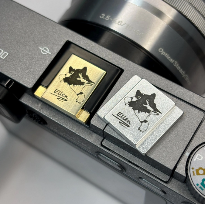 custom brass cat hot shoe cover on sony dslr camera