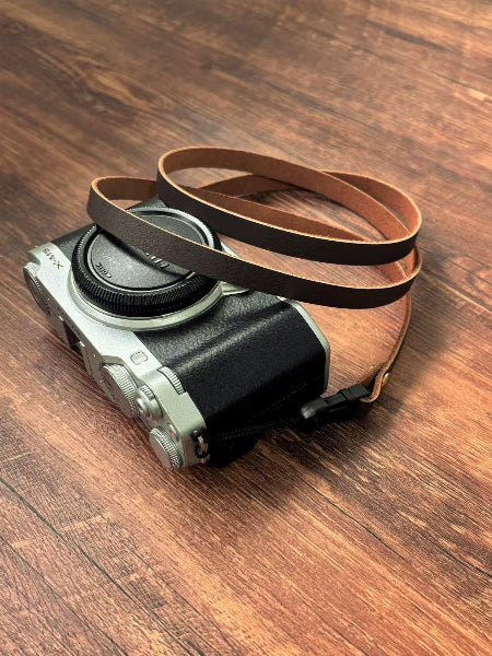 Slim cowhide dark brown camera strap detail