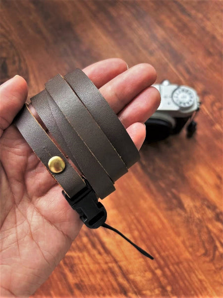 Slim grained leather camera strap detail