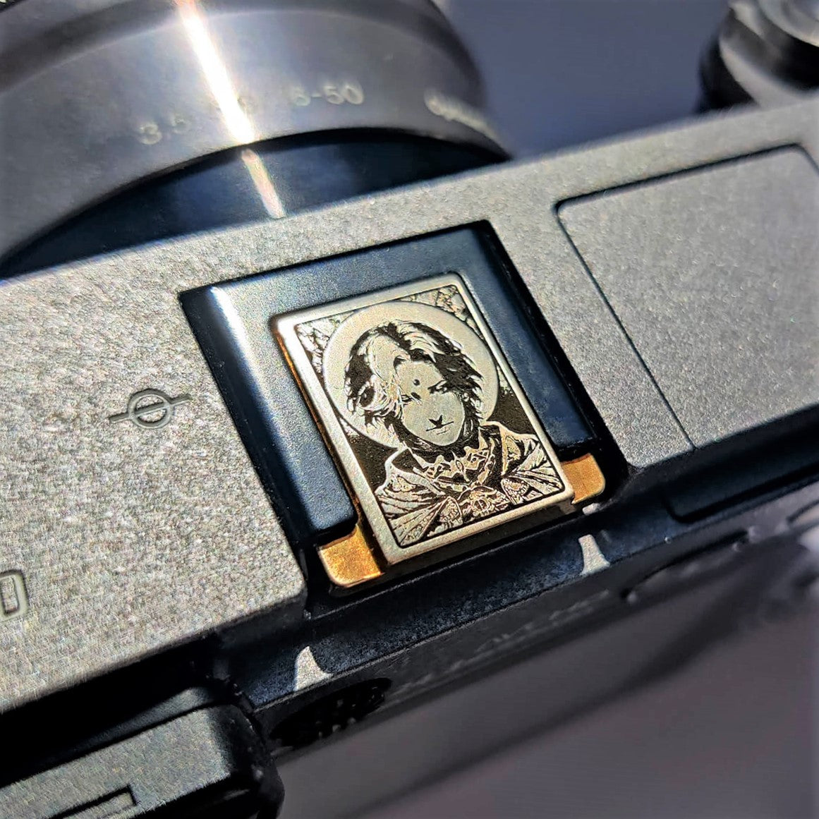 artistic hot shoe protector with Final Fantasy inspired engraving