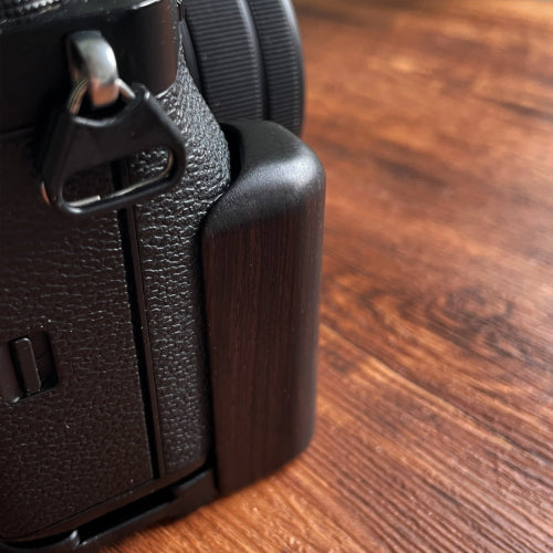 Close-up of a textured black wood Fuji X-T5 camera grip