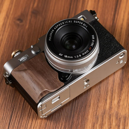 Fuji X-E5 camera with a wood grip on a wooden surface