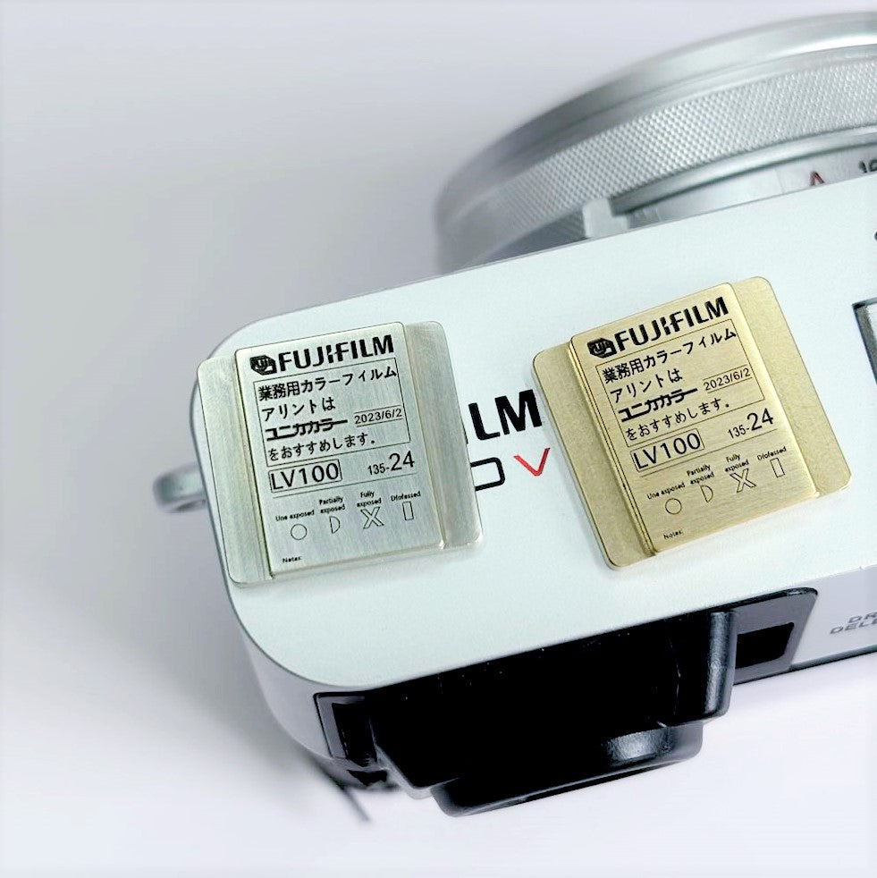 fujifilm x100 gold and silver hot shoe cover on camera