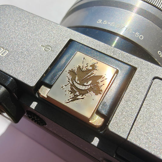 Gengar camera hot shoe cover on sony a6000 camera under llight