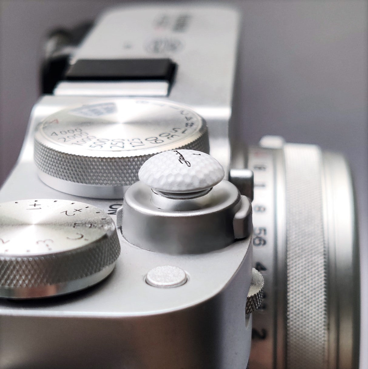 golf ball shaped shutter release button for cameras