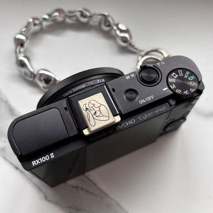 line art engraved hot shoe cover – Maggie Stephenson design