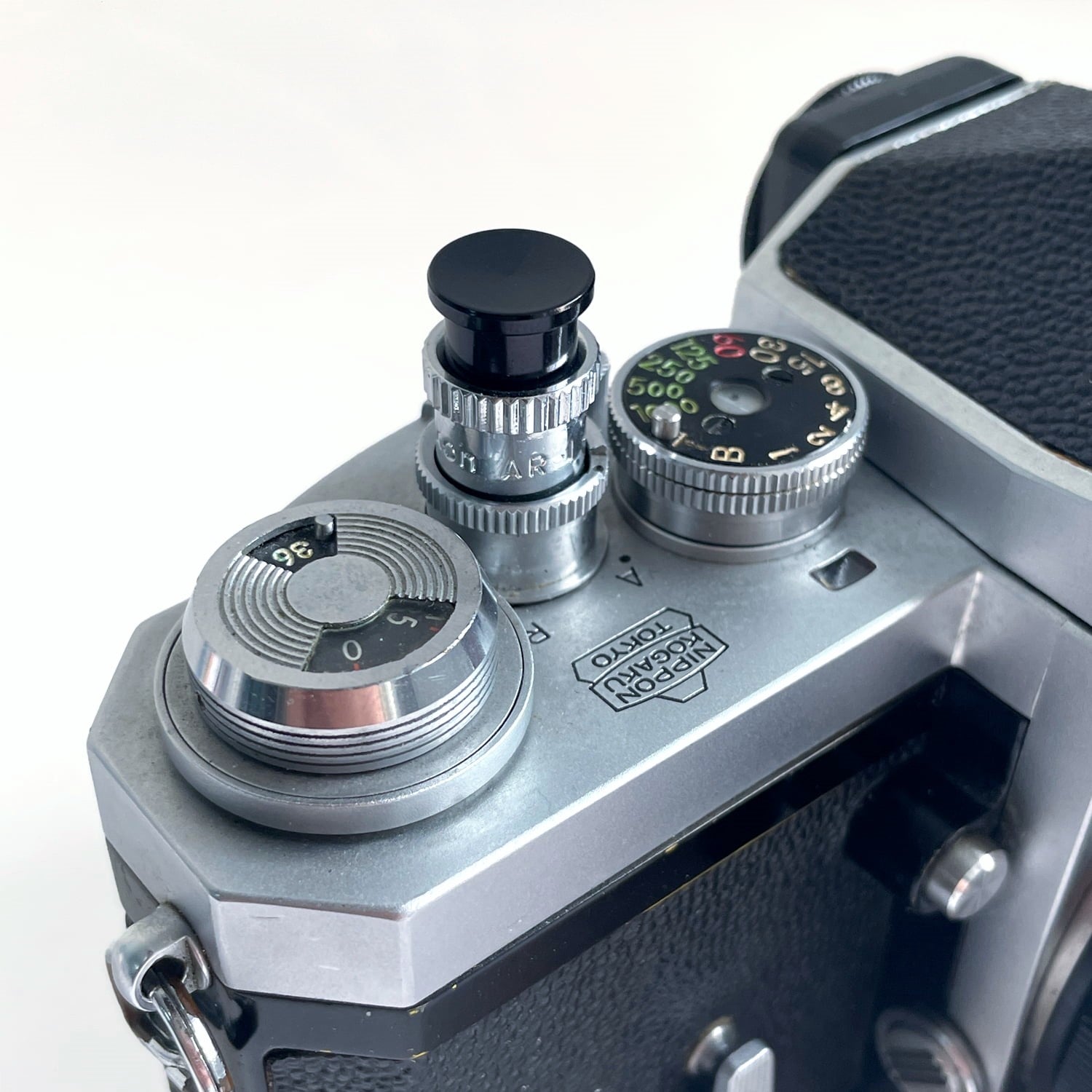 nikon film camera threaded shutter release button installed on Nikon F2