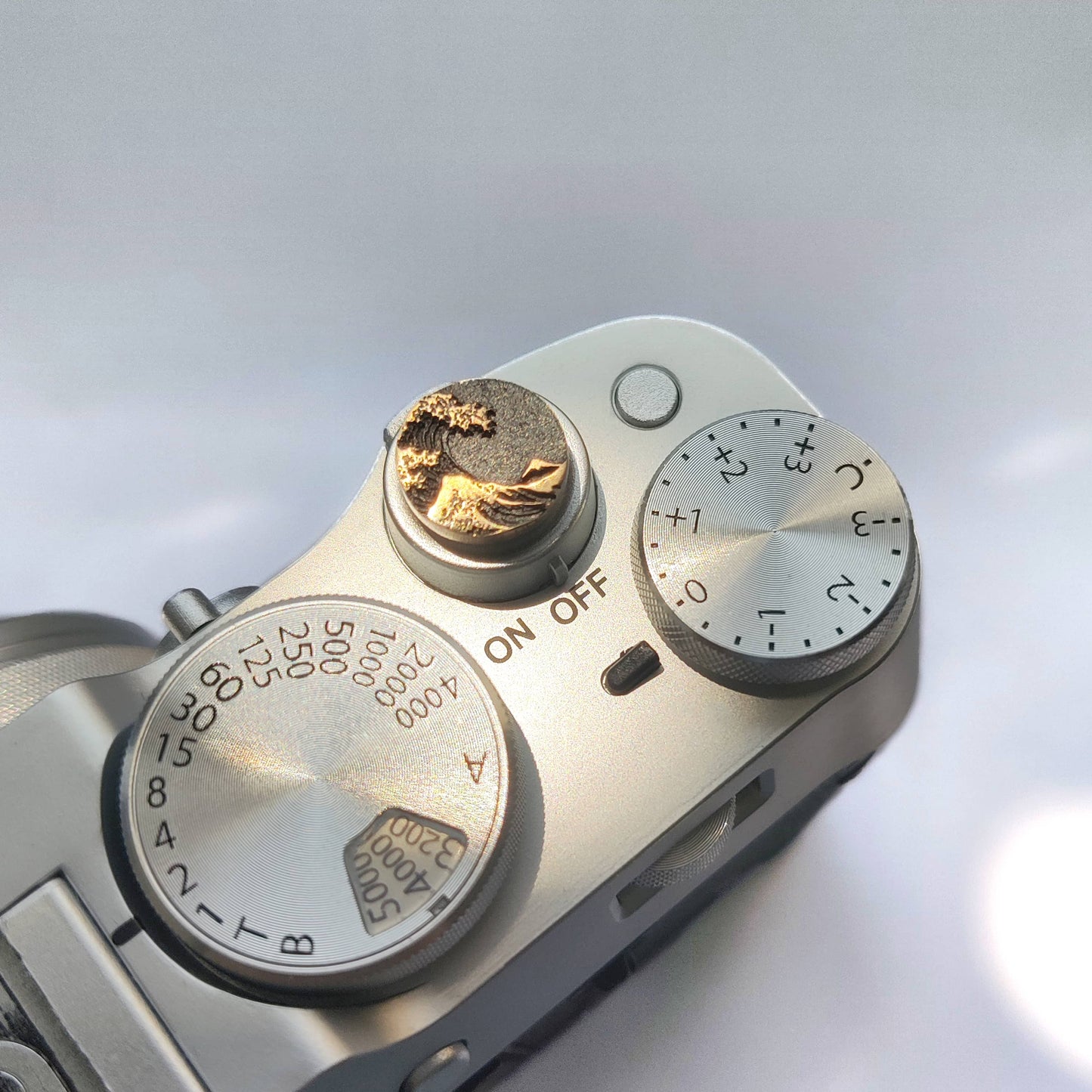 ocean crest gold camera shutter button on fujifilm x100