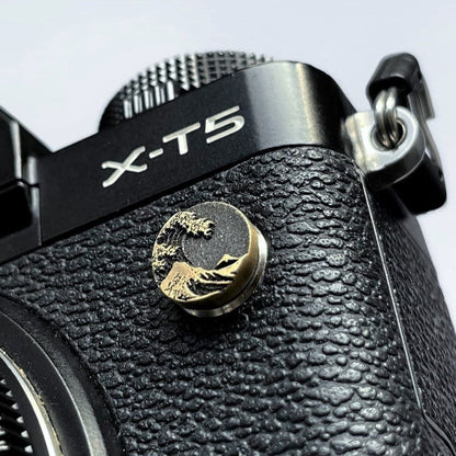 Close-up of a ocean wave design flash remote pc sync terminal cap cover Fujifilm camera
