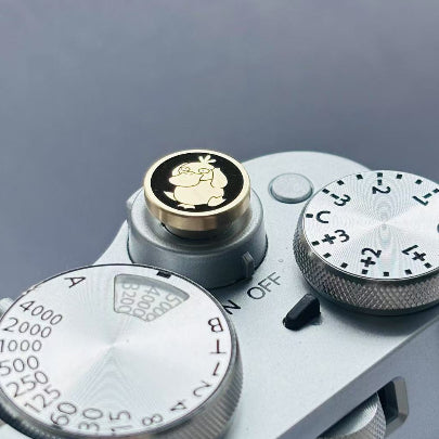 pokemon psyduck design camera shutter button sideview