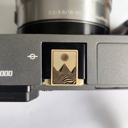 gold brass engraved pyramid hot shoe cover front view
