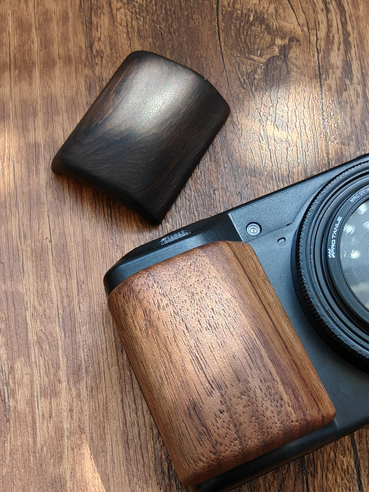 Walnut wooden grip attached to Ricoh GR III camera - left side view