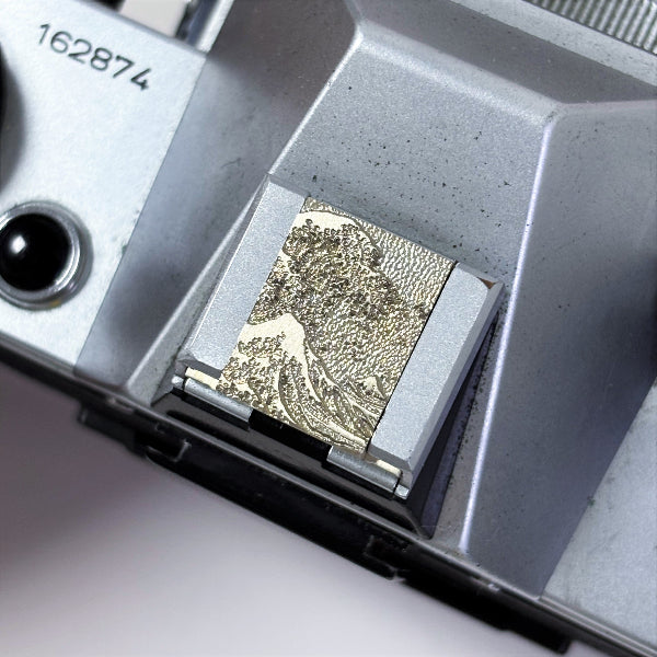 sea wave engraved white brass camera hoy shoe cover