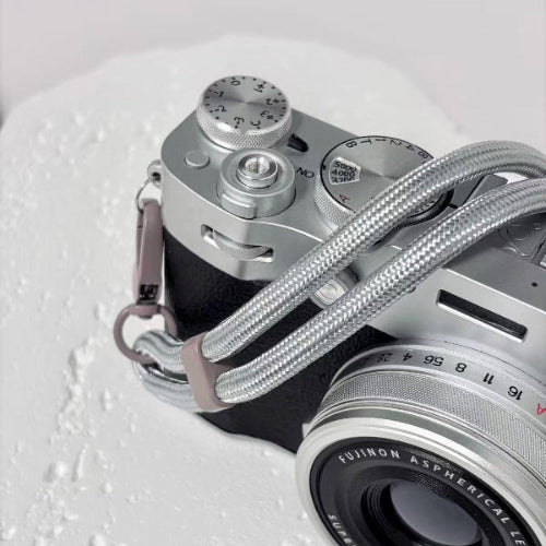 Silver camera wrist strap on fujifilm camera