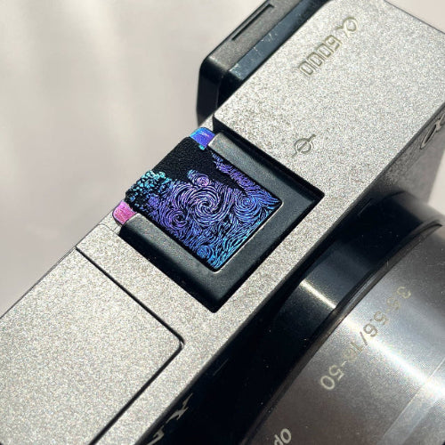 Close-up of a camera starry night hot shoe cover