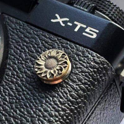 Close-up of a sunflower design flash remote pc sync terminal cap cover on FUJI X-T5 camera