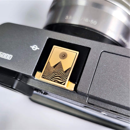 gold brass engraved pyramid hot shoe cover front view